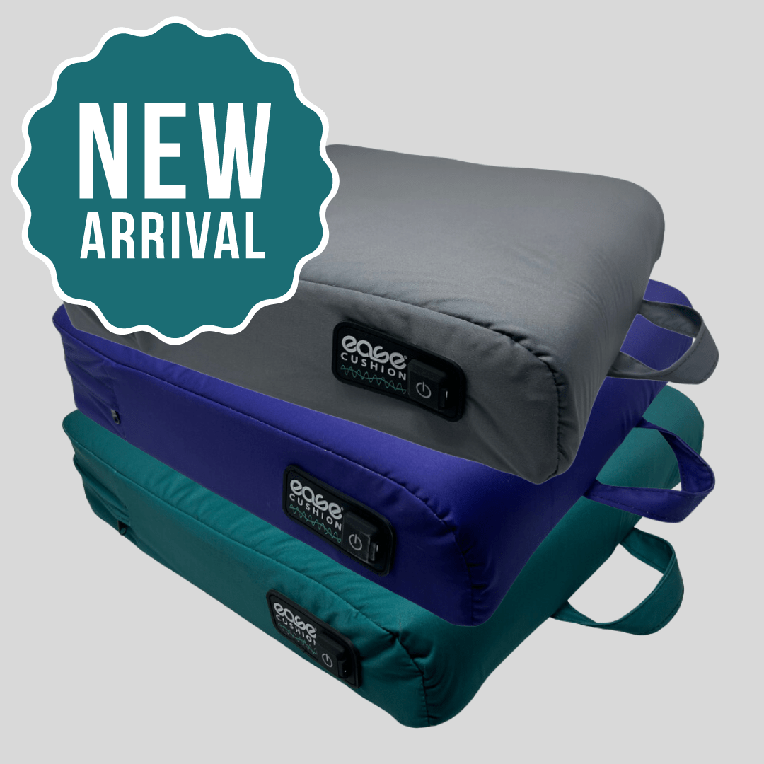 A stack of new Ease Cushion covers in gray, blue, and teal showcases its integrated handle and power button.
