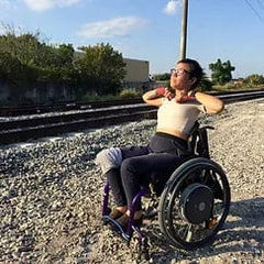 An Ease Cushion customer outdoors in a wheelchair